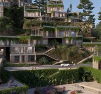 Stone Villa in Dhërmi surrounded by greenery and terraced terrain, alluring architecture.