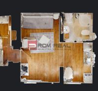 Floor plan of a one-bedroom apartment with a wood-patterned floor and a bathroom.