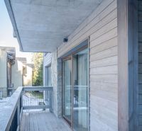 Balcony of a recreational apartment in Demänovská Dolina with a wooden decor floor.