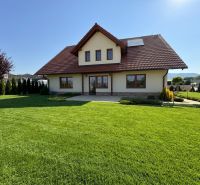 A family house in Trenčianska Turná with a spacious garden and a well-maintained lawn.