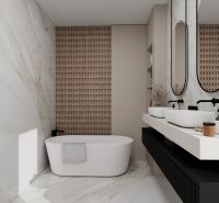 A bathroom with a bathtub, two sinks, and mirrors in a family house.