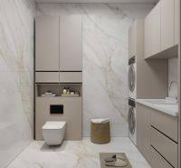 A bathroom in a family house with a washing machine, a cabinet, and marble tiles.