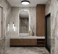 A bathroom in a family house with marble tiles and wooden elements.