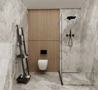 A bathroom in a family house with marble imitation on the walls and a glass shower enclosure.