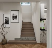 A staircase in a family house with a wooden decor floor and modern photographs on the wall.