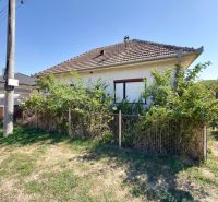A family house in Hruboňovo with a fenced front garden and a gable roof.