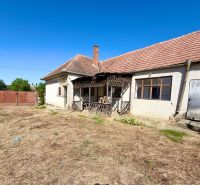 A family house in Hruboňovo with an older exterior and extensive land.