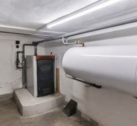 Gas boiler and storage tank in a family house.