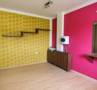 Colorful walls and a wooden decor floor in a family house.
