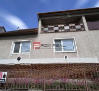 A family house on Štefánikova Street in Skalica with a brick facade and a garden fence.