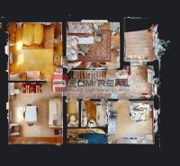 Floor plan of a family house with a wooden decor floor and various rooms.