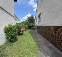 A family house on Štefánikova Street in Gbely with a lawn and ornamental shrubs.