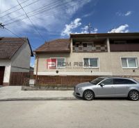 A family house on Štefánikova Street in Skalica with a car parked in front of the house.