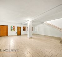 Spacious interior with tiles, stairs, and entrance doors, suitable for Land - housing.