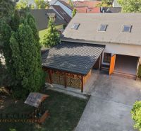 A courtyard in Pezinok with a garden shelter and a garage, Residential plots.