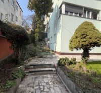 Garden at the villa on Bradlianska Street, Bratislava - Old Town, with a stone path.