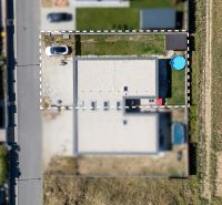 Aerial view of a family house in Trenčianske Jastrabie, yard with a car and a swimming pool.