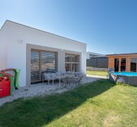 A family house in Trenčianske Jastrabie with a garden, swimming pool, children's playhouse, and terrace.