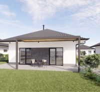 A family house in Prašník with a terrace, garden seating, and a green lawn.