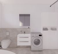 Bathroom in a family house with a washing machine, a shower, and storage space.