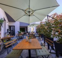 Furnished terrace of gastro premises in Bratislava - Old Town with seating and umbrellas.