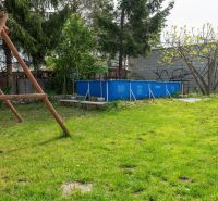 Garden in Dunajská Lužná, Kováčska, with a swing and a pool, ideal for residential plots.