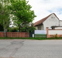 House on Kováčska Street in Dunajská Lužná with land - living, fencing, and greenery.
