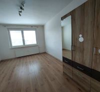 A room with a wooden floor decor and a wardrobe in a 3-room apartment.