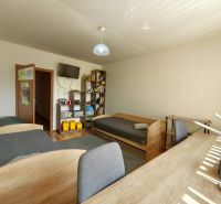 Children's room with two beds, a desk, and a shelf in a 3-room apartment.