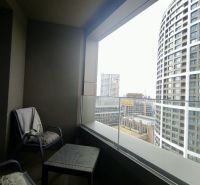 A balcony with a view of modern architecture from a 2-room apartment on Továrenská Street, Bratislava - Staré Mesto.