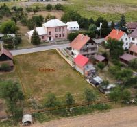 Lands - housing in Podbranč, rural landscape with surrounding houses and greenery.