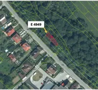 Aerial view of agricultural and forest land in Olešná with marked parcels.