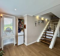 Stairs and floor with wood decor in a family house with storage space.