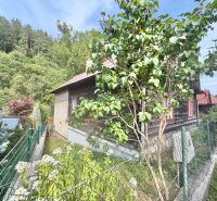 A family house in Ochodnica on Ochodnica Street surrounded by nature with a wooden decor facade.