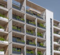 Apartment building with plants on balconies in Bratislava - Rača, exterior of the building.