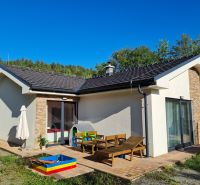A family house on Zadarska Street in Banska Bystrica with a terrace and a children's playground.