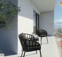 A balcony with a view of Poprad, part of a 3-room apartment; chairs, a table, and a plant.