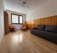 Living room with a sofa set, armchairs, and a wooden decor floor in a 4-room apartment.