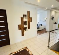 Interior of a family house with a wooden decor floor and decorative niches.
