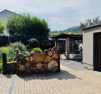 A family house in Radobica with a modern terrace, garage, and landscaped garden.