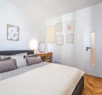 A comfortable bedroom with a bed, an armchair, and decorations, a 3-room apartment.