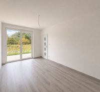 Interior with wood decor flooring and large windows in a family house.