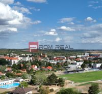Aerial view of Modra with a football field and surrounding residential areas.