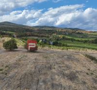 Hilly landscape in Modra, residential land surrounded by nature and vineyards.