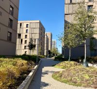 Apartment buildings on Račianska Street in Bratislava - Nové Mesto with landscaped greenery.