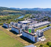 Aerial view of the Dlhé lúky area, Púchov with apartment buildings and surrounding nature, suitable for a 3-room apartment.