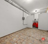 Technical room with a boiler in a family house. Floor with tile decor.