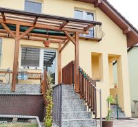 A family house in Medzibrod with an outdoor terrace, wall planters, and a staircase.