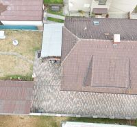 Aerial view of a family house in Medzibrod with a garden and a gazebo.