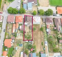 Aerial view of family houses in Medzibrod with adjacent gardens and roads.